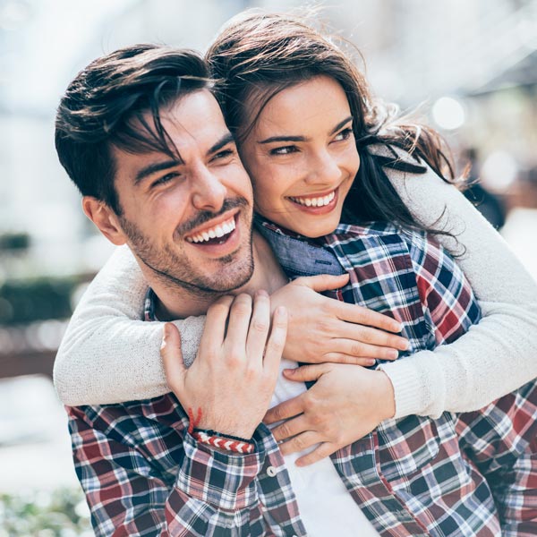 Young couple in Tempe, AZ, happy with the results of cosmetic dentistry at Tempe Smiles