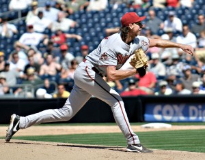 A baseball player in action, preparing to throw a pitch on the field in Tempe, AZ