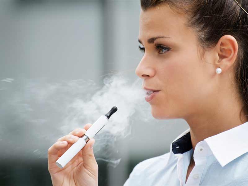 woman smoking vape pen