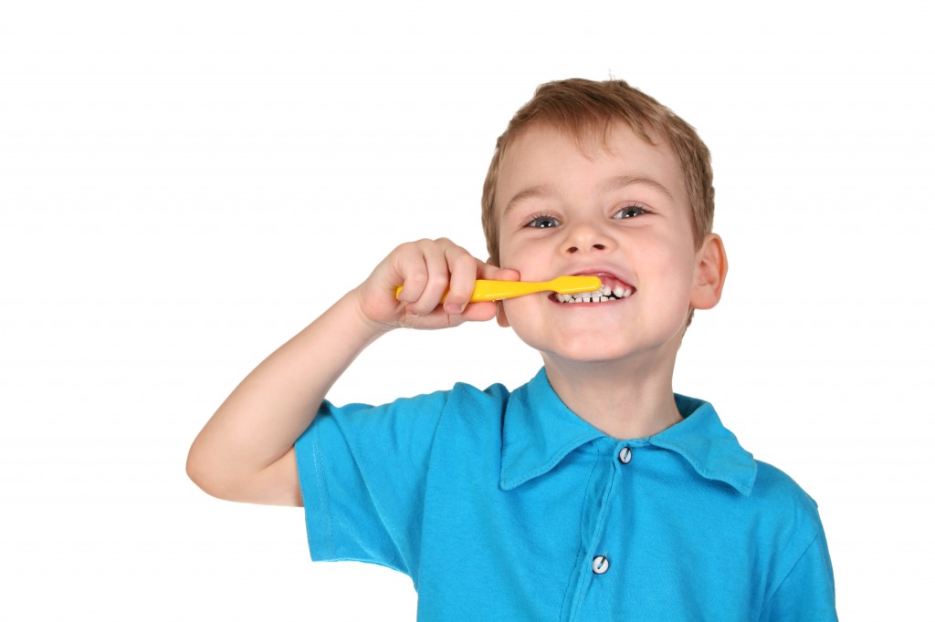 little boy brushing teeth