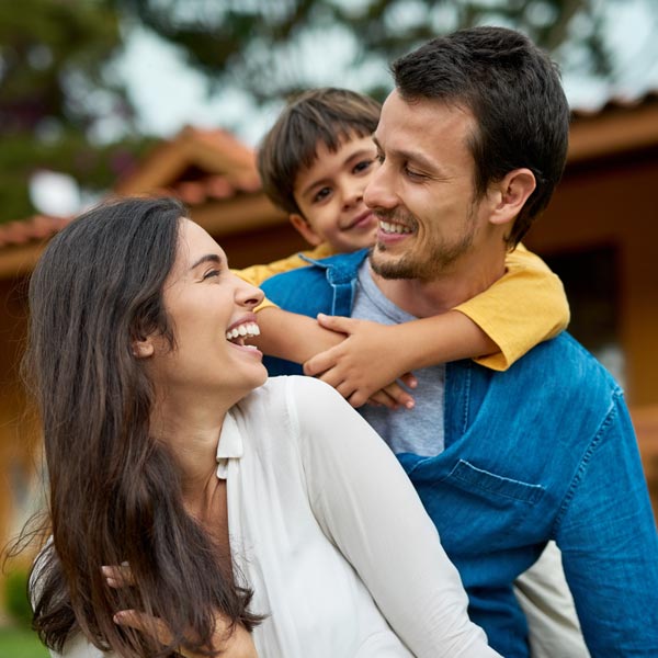 laughing family of three