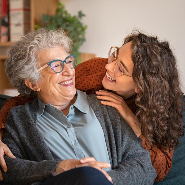 grandmother and adult grandchild smiling