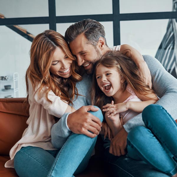 family of three laughing
