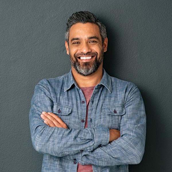 A smiling man requested a dental appointment at Tempe Smiles in Arizona.