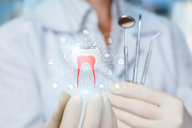 Hologram of tooth being held by dentist